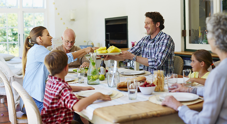 extended family having meal at dining room table