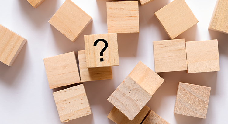wooden blocks with question marks